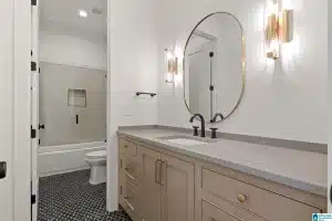 a bathroom with a mirror and a toilet
