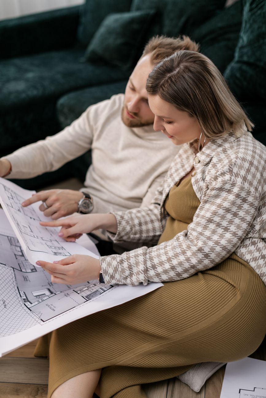 couple looking at a blueprint